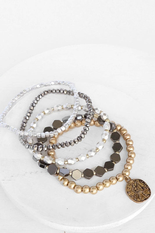 Bracelet Stack with a Coin